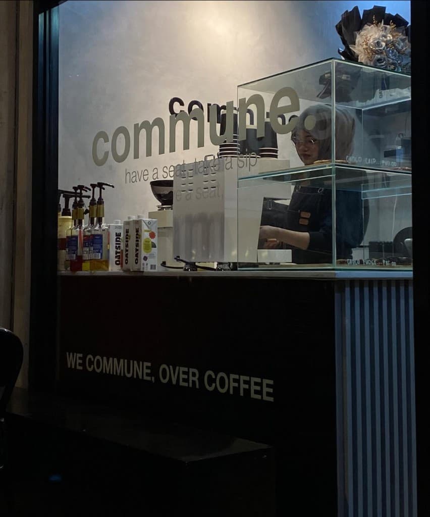 commune cafe storefront at night